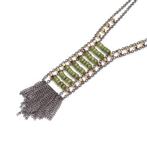 Exaggerated tassel necklace with emerald green beads and multi-strand gunmetal chains