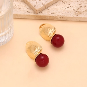 Vintage geometric alloy earrings with gold hammered discs and deep red resin drops