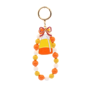 Detailed view of Halloween candy corn charm keychain with colorful beads and red bow