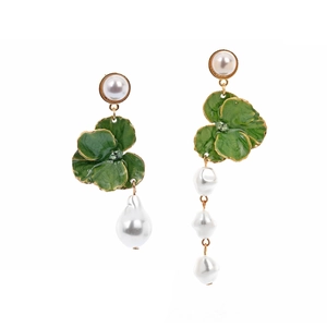 Asymmetric flower earrings with green enamel and Baroque pearls on white background