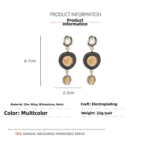 Macro view of vintage geometric earrings showing 6.7cm height and rhinestone details