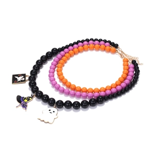 Detailed view of Halloween beaded necklaces with ghost and wizard hat pendants