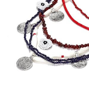 Bohemian multi-strand beaded waterfall necklace with silver medallion and evil eye charms
