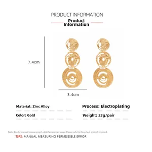 Detailed view of large gold spiral drop earrings with precise dimensions and zinc alloy material