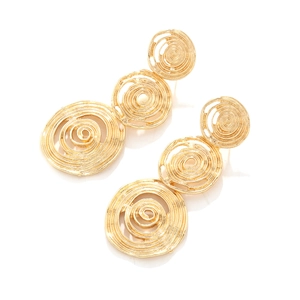 Detail of golden triple spiral drop earrings with brushed metal texture on white background