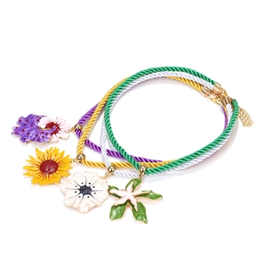 Set of four colorful rope necklaces with enamel sunflower and starfish flower pendants