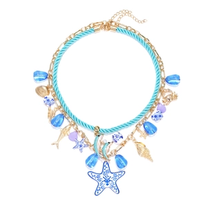 Multilayer ocean themed necklace with starfish and dolphin charms on golden chain