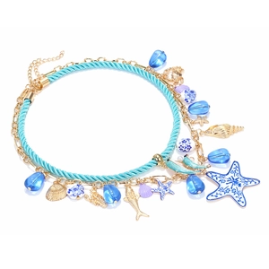 Layered beaded ocean necklace with golden starfish shells and blue drop charms