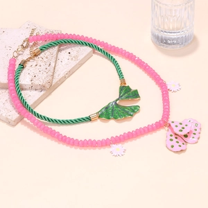 Layered bohemian necklace set featuring floral enamel leaf pendants and pink beaded chain