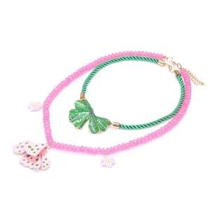 Layered beaded flower and leaf pendant necklace set with pink beads and green rope