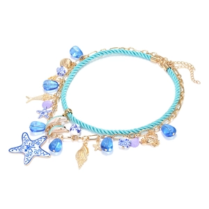 Layered ocean theme necklace with starfish dolphin shell pendants and turquoise rope