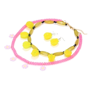 Multi-layer starfruit floral jewelry set with pink daisy and yellow gradient bead necklace