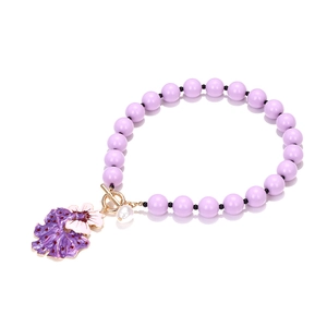 Bohemian purple beaded flower necklace with gold T-bar clasp and pearl pendant