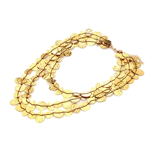 Three-layer gold tiered waterfall necklace with hammered metal sequins and lobster clasp