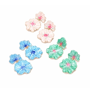 Detailed macro view of colorful enamel flower drop earrings in pink, blue and green