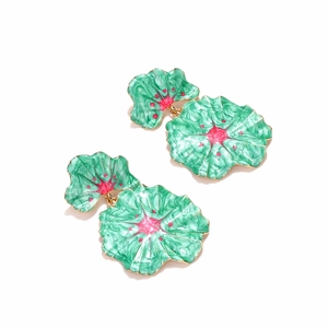 Detailed macro of enamel flower earrings with vibrant green and pink floral petals