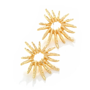 Textured gold sunburst stud earrings with artistic radial pattern on white background