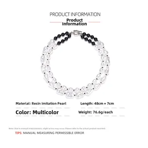 Detail view of double-layered baroque pearl necklace with resin beads and toggle clasp