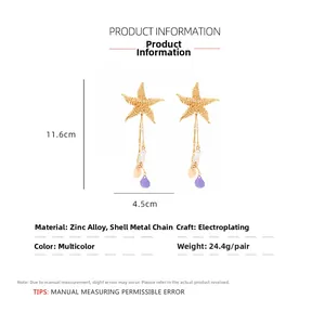 Detailed view of gold starfish earrings with shell and purple beads measuring 11.6cm