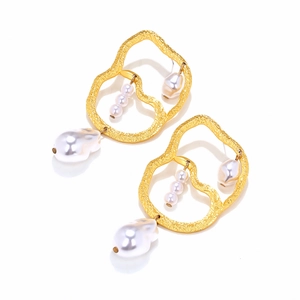 Golden baroque pearl drop earrings with hammered metal texture and geometric frame