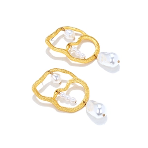 Modern Baroque pearl drop earrings with textured gold hoops and irregular pearls