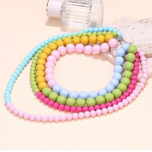 Detailed close-up of multilayered colorful beaded necklace with secure lobster clasp