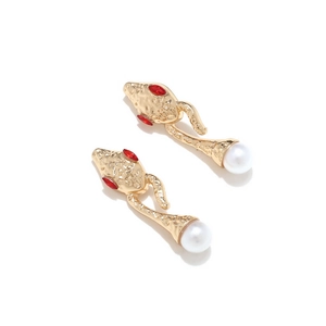 Golden snake-shaped drop earrings with red stone eyes and large white round pearl charms