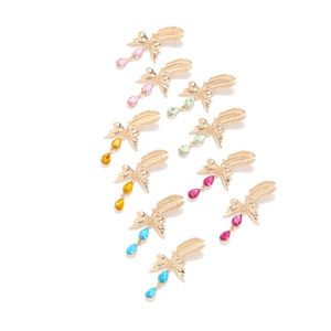 Detail of colorful feather bow earrings with teardrop crystal pendants in five vibrant hues