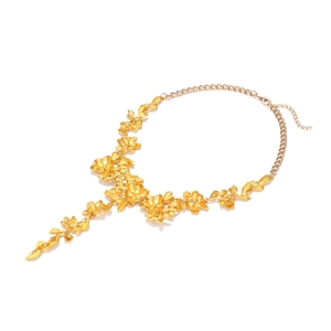 Vintage gold tone floral pendant necklace with realistic sculpted metal flower leaves