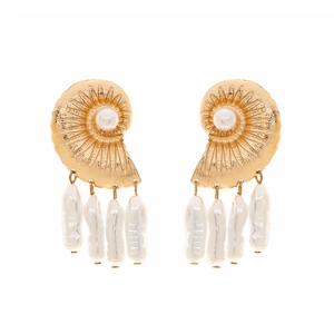 Golden conch shell earrings with baroque pearl pendants in a nautical resort style