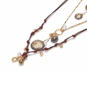 Layered bohemian necklace set with antique coins, faux pearls and brown resin charms