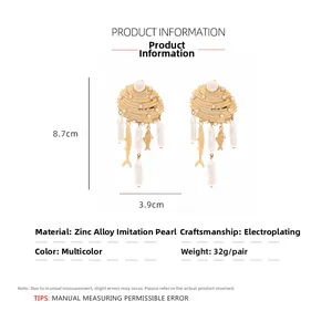 Détails des boucles d'oreilles poisson avec dimensions précises de 8,7 x 3,9 cm