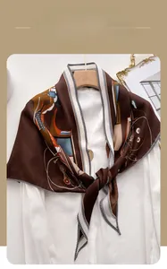 Detail view of herringbone velvet scarf with geometric prints and brown silk texture