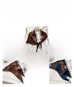 Detailed pattern of a velvet luxury scarf featuring carriage and geometric prints