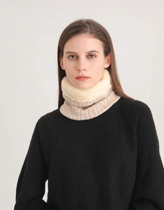 Close-up of thick ribbed knit snood scarf with soft white faux fur plush lining