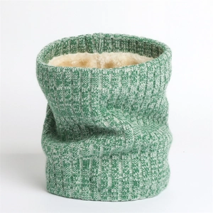 Detail of green ribbed knit scarf with thick white faux sherpa lining for warmth