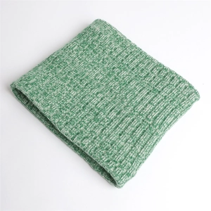 Close-up of thick ribbed knit texture on a green and white marled winter neck warmer
