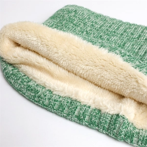 Close-up of thick ribbed knit neck warmer with warm white plush lining detail