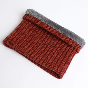 Detailed view of red-brown ribbed knit scarf with thick dark grey faux lamb wool lining
