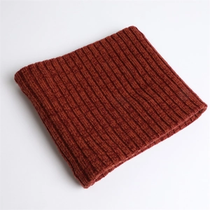 Close-up of thick rib-knit texture on a warm brick red winter neck warmer scarf