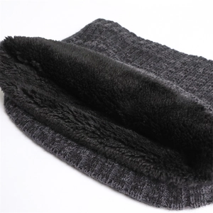 Detail of winter rib-knit neck warmer with thick dark grey exterior and black fleece lining