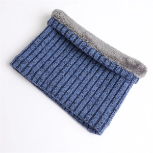 Close-up of blue ribbed knit snood scarf with thick grey faux fleece lining for winter warmth