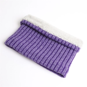 Close-up of winter ribbed knit neck warmer with thick purple exterior and white faux fur lining