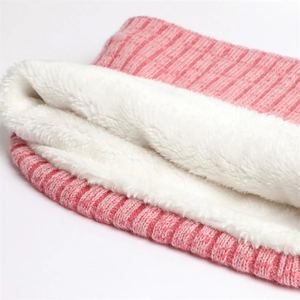 Detail of pink ribbed knit neck warmer with soft white sherpa fleece lining and thick layer