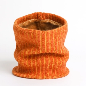 Close-up of ribbed knit orange scarf with thick brown plush lining for winter warmth