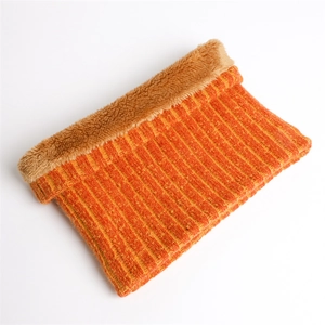 Detail of ribbed knit winter neck warmer featuring thick orange stripes and plush lining