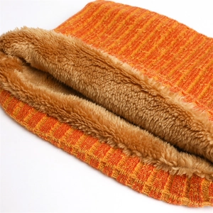 Detail of chunky ribbed knit neck warmer with soft brown plush faux fur lining for winter