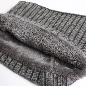 Detail of dark grey ribbed knit scarf with thick fleece lining for winter warmth