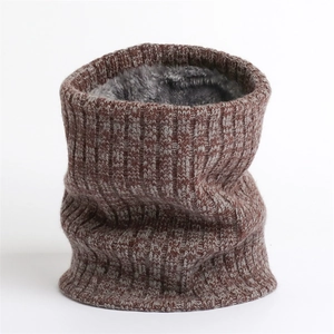 Detail of thick winter knit snood with warm grey faux fur lining and ribbed texture