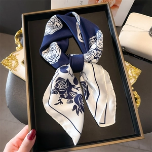 Elegant silk-like square scarf featuring navy blue rose floral print in a stylish bow knot